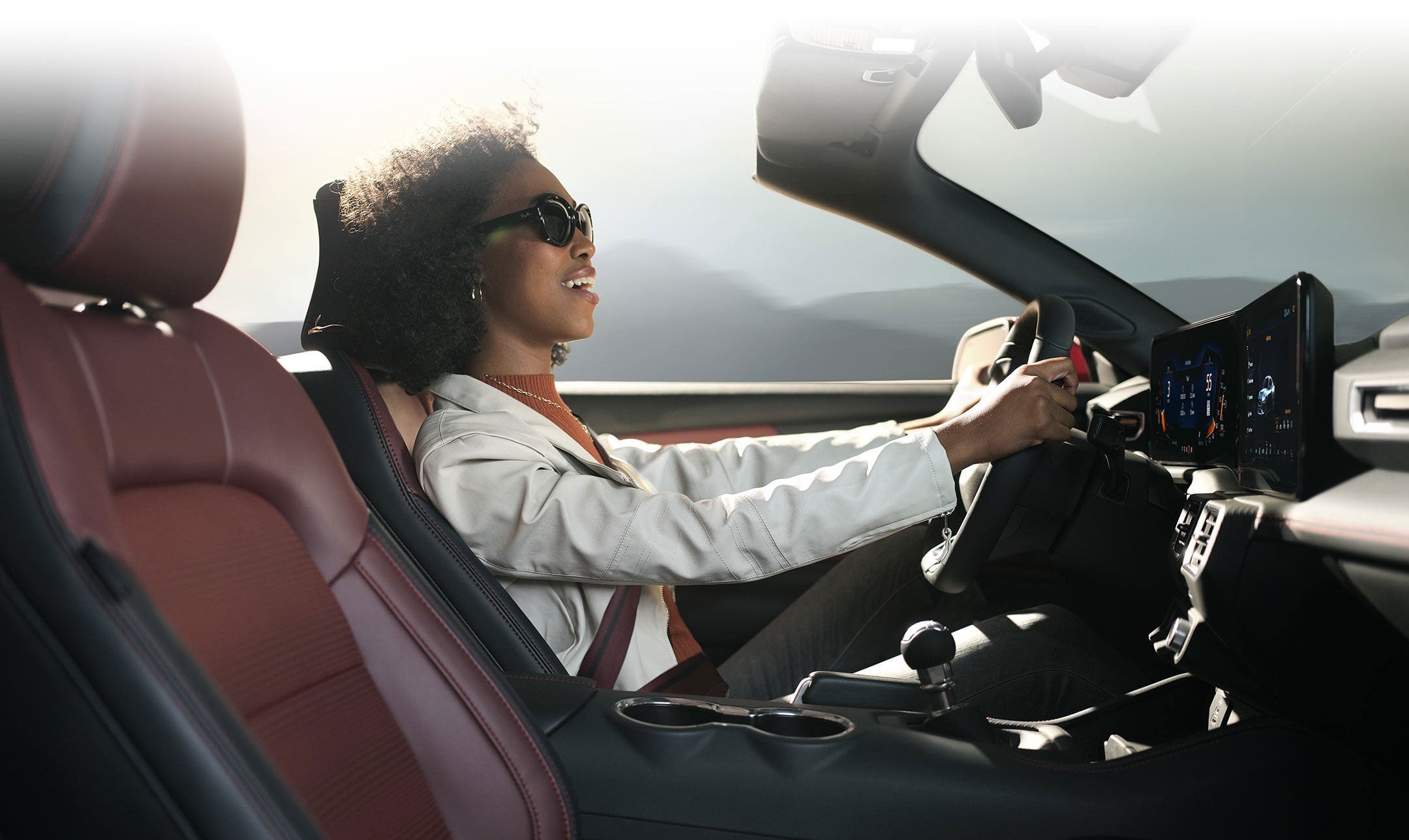 Person sitting in the driver’s seat of a 2024 Ford Mustang® convertible | Freedom Ford Greenville by Ed Morse in Greenville TX