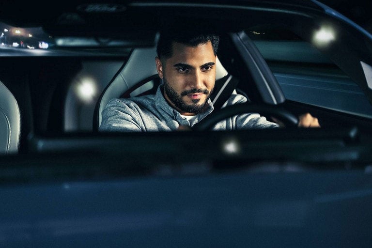 Person sitting in the driver’s seat of a parked 2024 Ford Mustang® coupe | Freedom Ford Greenville by Ed Morse in Greenville TX